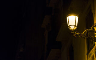 single lamp on dark street